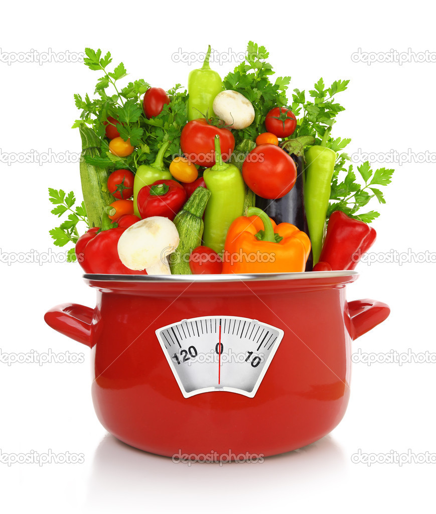 Diet concept. Colorful vegetables in a red cooking pot 