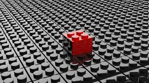 Schwarzer Lego-Hintergrund mit einem roten Block, der heraussticht — Stockfoto