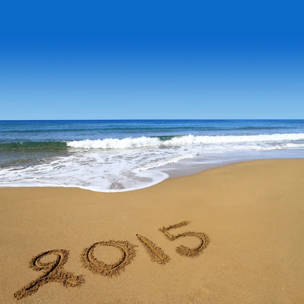 2015 rédigés sur la plage de sable fin — Stock fotografie