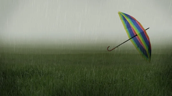 Rainy landscape with umbrella carried away by the wind — Stock Photo, Image