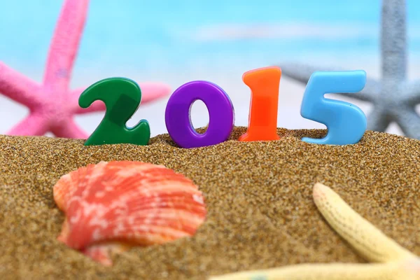 Wielobarwny nowy rok 2015 na plaży — Zdjęcie stockowe