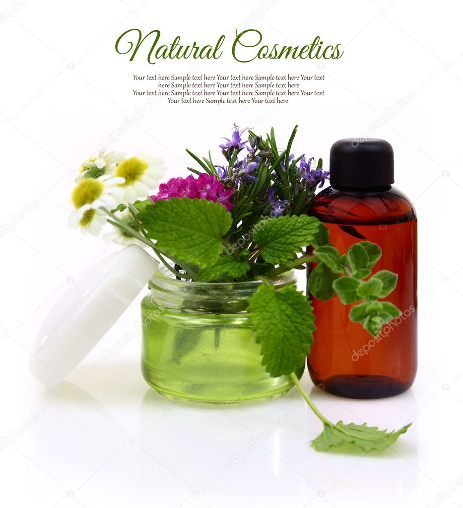 Cosmetic cream jar with herbs inside and essential oil bottle