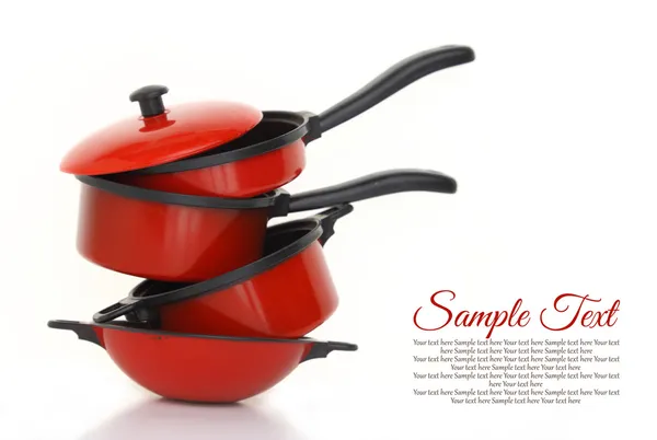 Red cookware set on white background — Stock Photo, Image