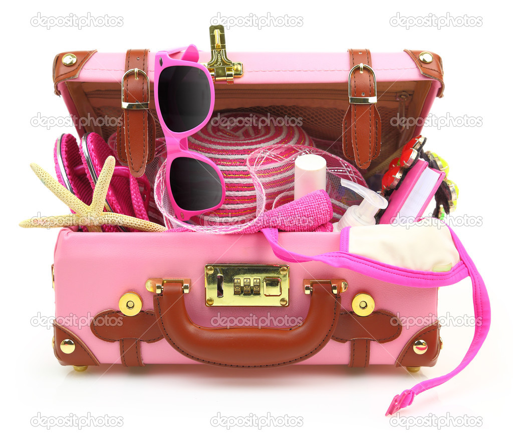 Ready to travel pink suitcase with summer equipment isolated 