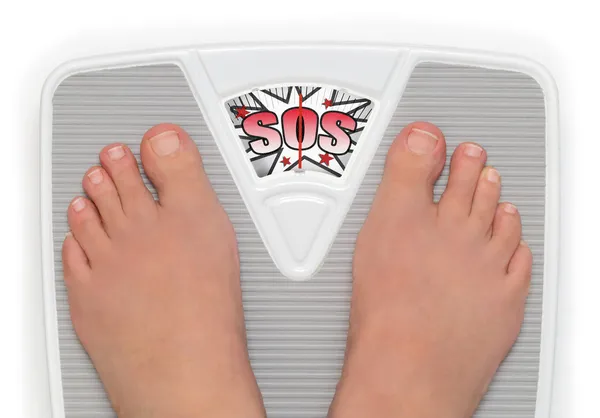 Female feet on funny bathroom scale — Stock Photo, Image