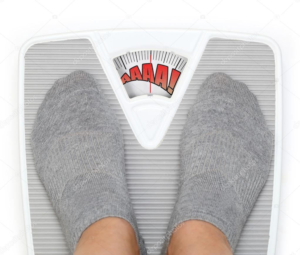 Female feet on funny bathroom scale Stock Photo by ©viperagp 45843801
