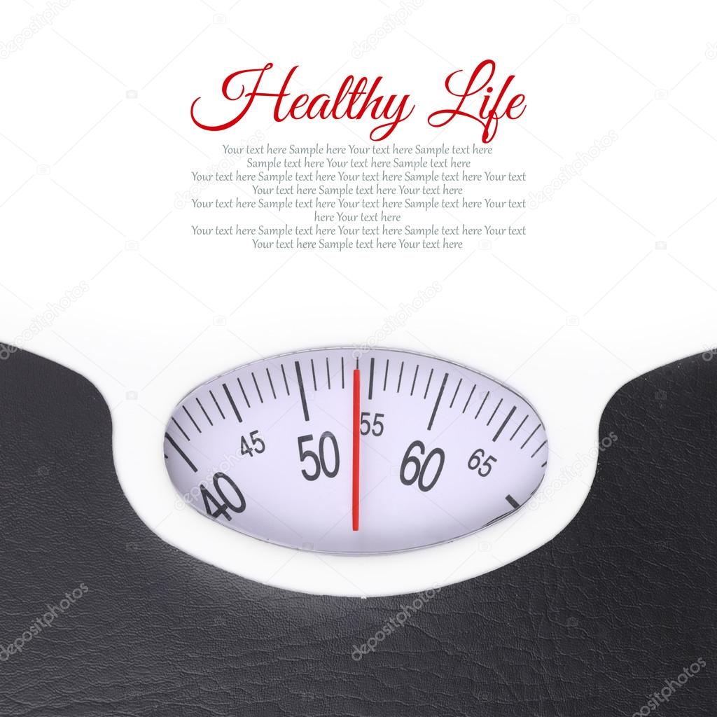 Close up of bathroom scale on white background