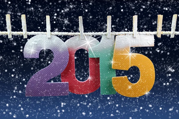 Number 2015 hanging on a clothesline in a night wintry background — Stock Photo, Image