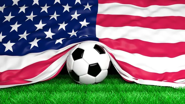 Pelota de fútbol con bandera de EE.UU. en el primer plano del campo de fútbol —  Fotos de Stock