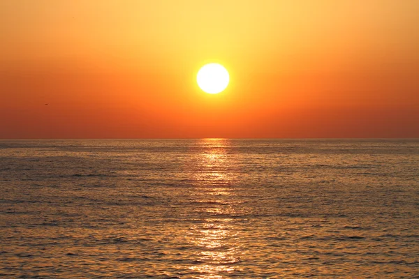 Golden sunset with reflection on the sea — Stock Photo, Image