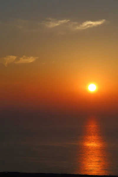 Deep orange color sunset on the beach — Stock Photo, Image