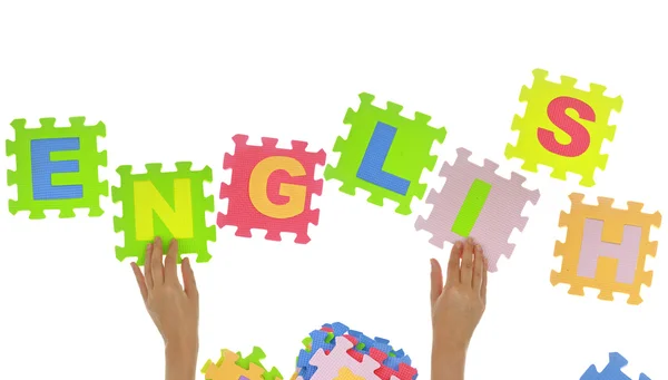 Hands forming word "Education" with jigsaw puzzle pieces isolated — Stock Photo, Image