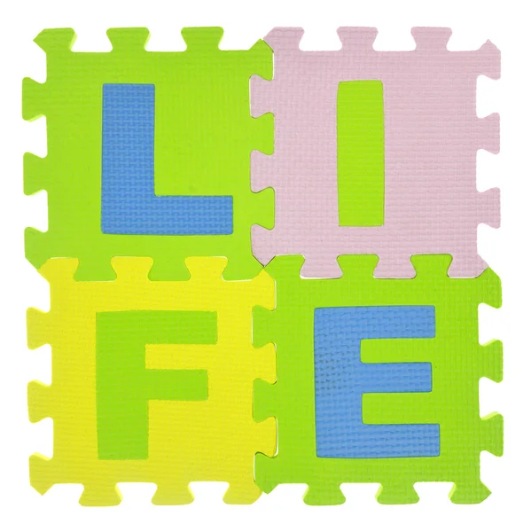 Word "Life" with jigsaw puzzle pieces isolated — Stock Photo, Image