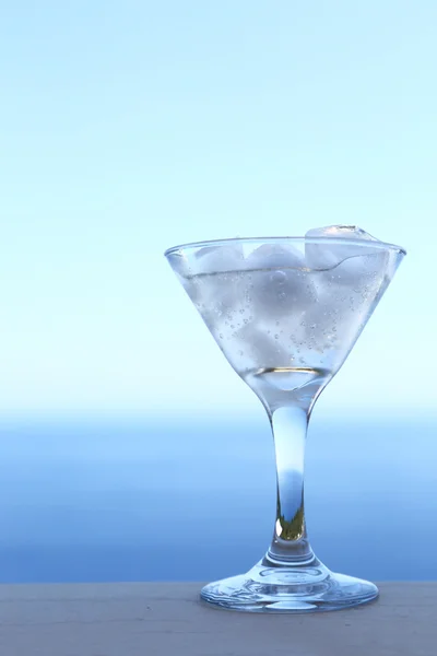 Cold transparent cocktail in glass with ice cubes — Stock Photo, Image