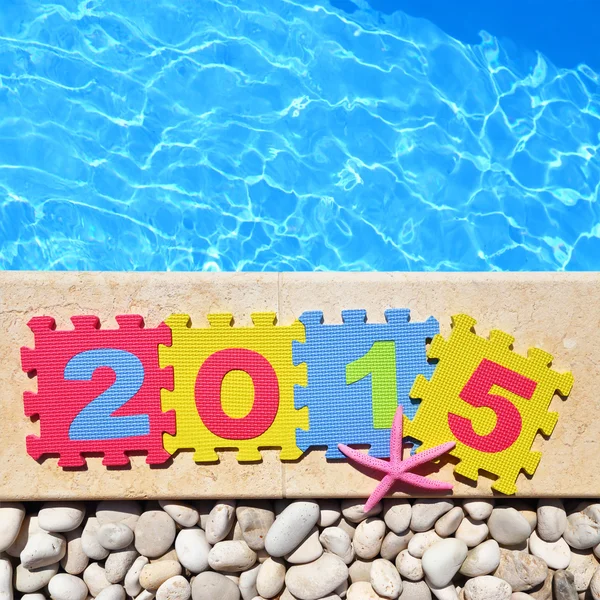 "2015" by poolside made with jigsaw puzzle pieces — Stock Photo, Image