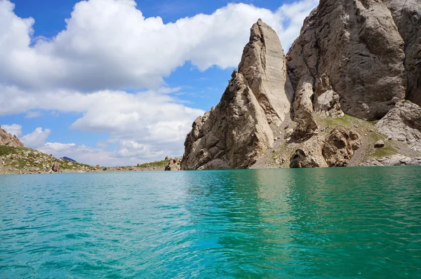 Fine rocks are reflected in high-mountainous lake and amazing colour of the sky — Zdjęcie stockowe