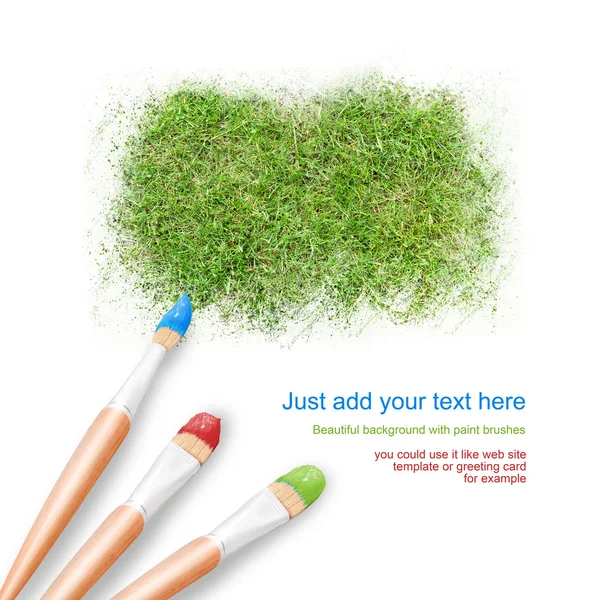 White background with three paintbrushes painting green grass un — Stock Photo, Image