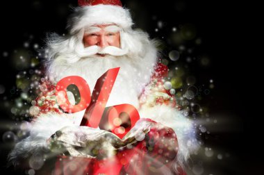Noel Baba onun ihale ve gülümseyerek. ışıklar ve sparks f vardır