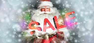 Noel Baba onun ihale ve gülümseyerek. ışıklar ve sparks f vardır