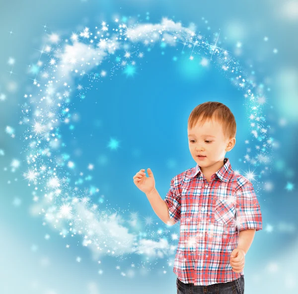 Little boy conjuring with his hands — Stock Photo, Image