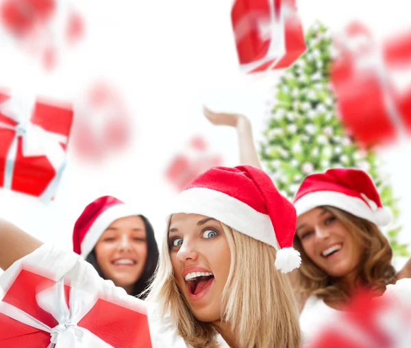 Excited attractive three women with many gift boxes and bags fal Stock Photo