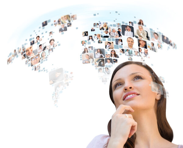 Young woman looking at worldmap with profile photos of her frien