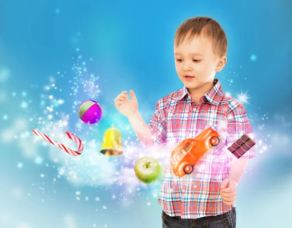 Little boy conjuring with his hands — Stock Photo, Image