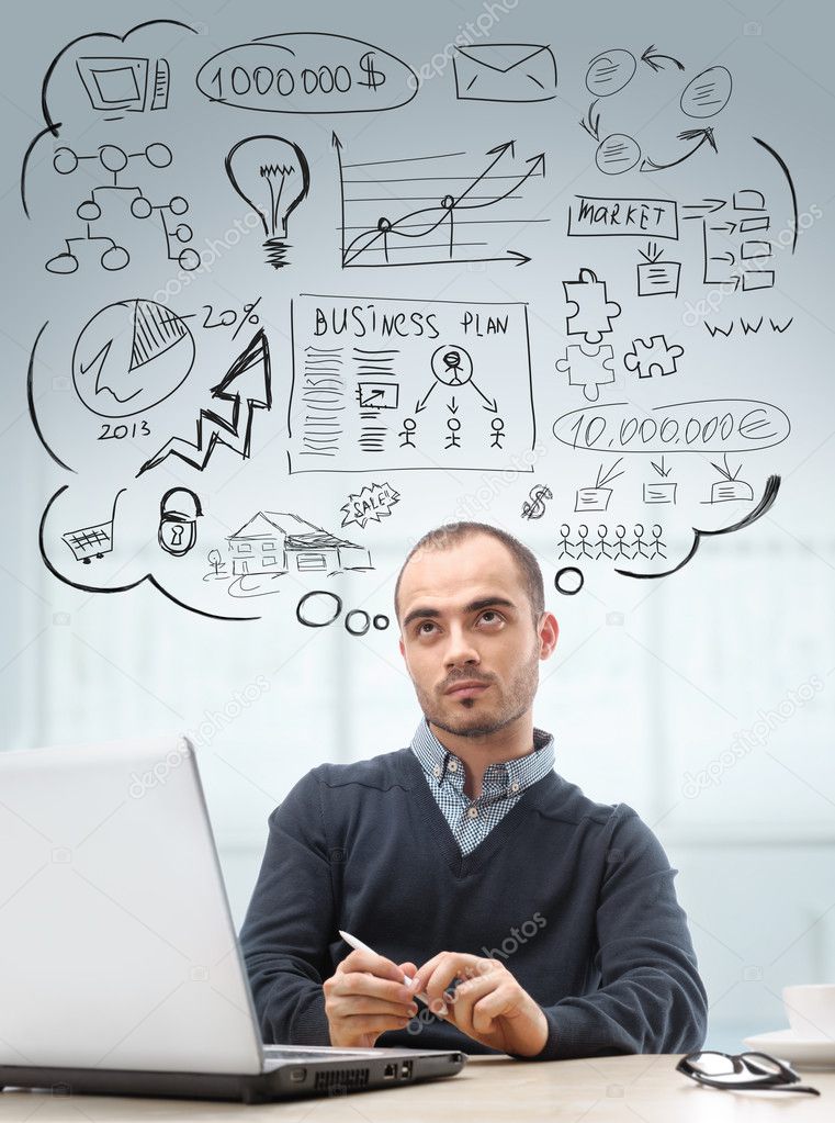 Young business man sitting at office looking up and planning. Gr