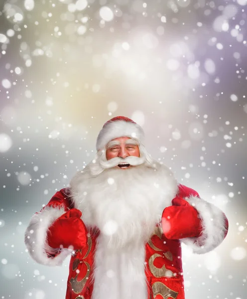 Laughing happy Santa Claus over snowflake background — Stock Photo, Image
