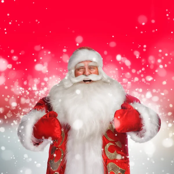 Laughing happy Santa Claus over snowflake background — Stock Photo, Image