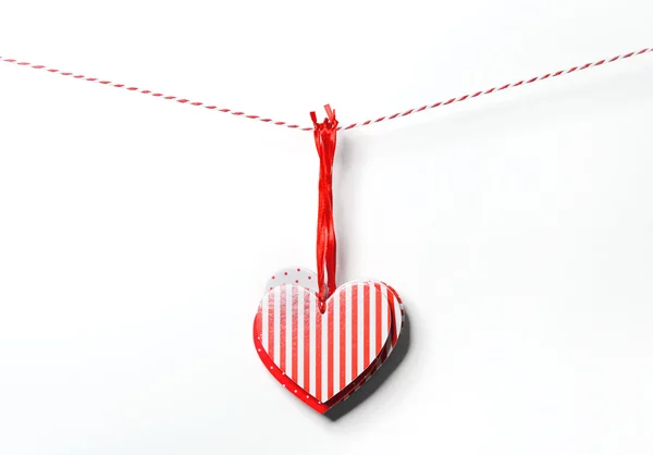 Red textured hearts hanging on white background — Stock Photo, Image