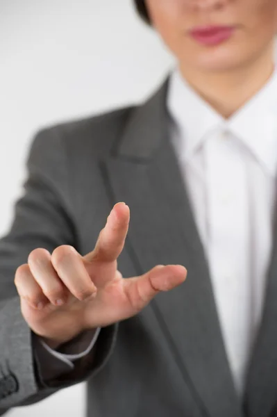 Business woman pointing her finger on imaginary virtual button Stock Picture