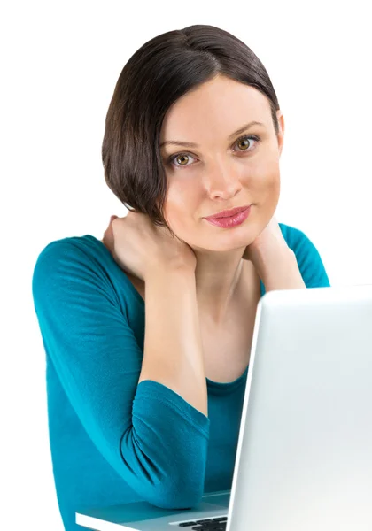 Portrait of young woman dreaming in front of laptop — Stock Photo, Image
