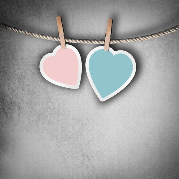 Valentine background: two hearts hanging on clothespin. Couple c — Stock Photo, Image