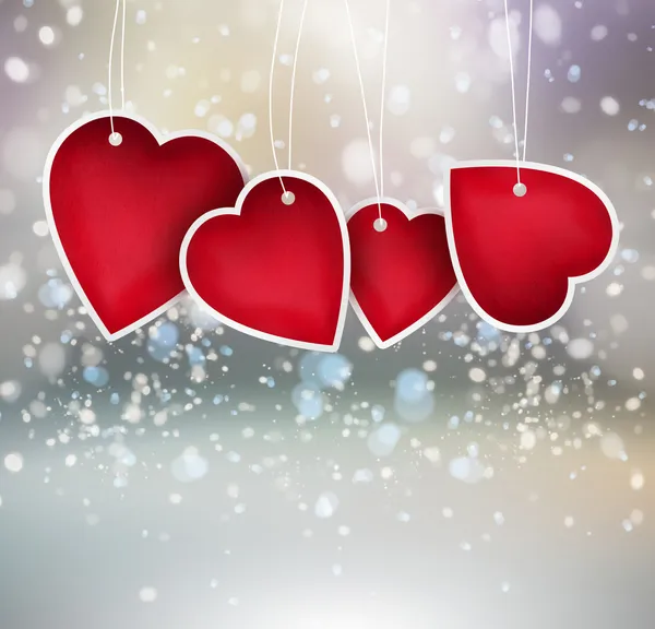 Valentine hjärta hängande etiketter på lysande bakgrund — Stockfoto