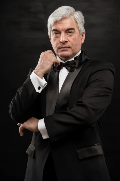 Portrait of handsome mature business leader over black backgroun — Stock Photo, Image