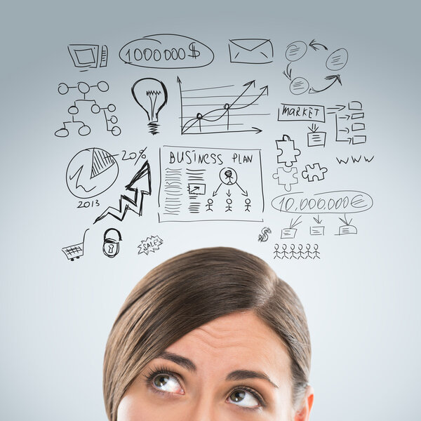 Young business woman thinking of her plans closeup face portrait