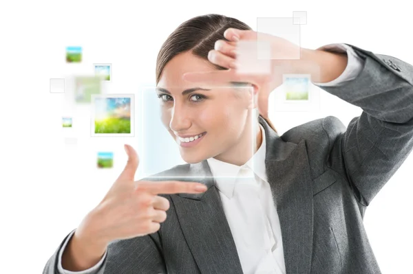 Portrait of beautiful business woman making frame gesture — Stock Photo, Image