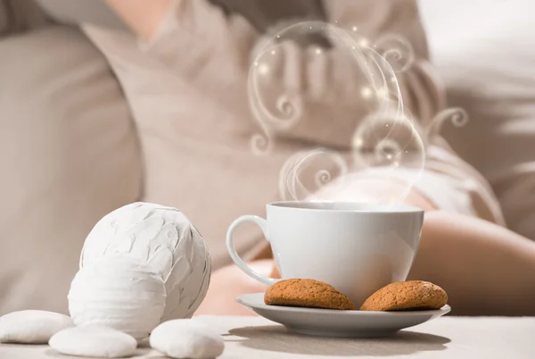 Cup of hot beverage tea or coffee with oat cookies and a lot of — Stock Photo, Image