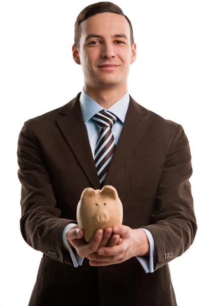 Jovem homem de negócios feliz segurando piggybank sobre fundo branco — Fotografia de Stock