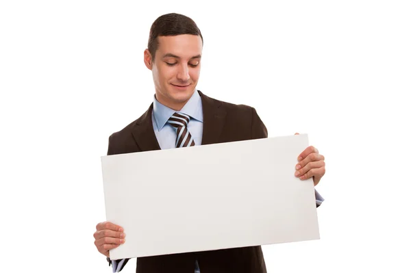 Portrait of a happy young business man holding a blank board — Stock Photo, Image