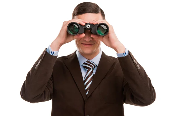 Primer plano de un joven hombre de negocios mirando a través de binocular — Foto de Stock