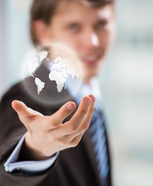 İş adamı iş dünyasını elinde tutuyor