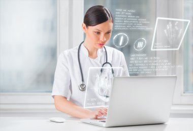 Pretty female medicine doctor working with modern computer inter clipart