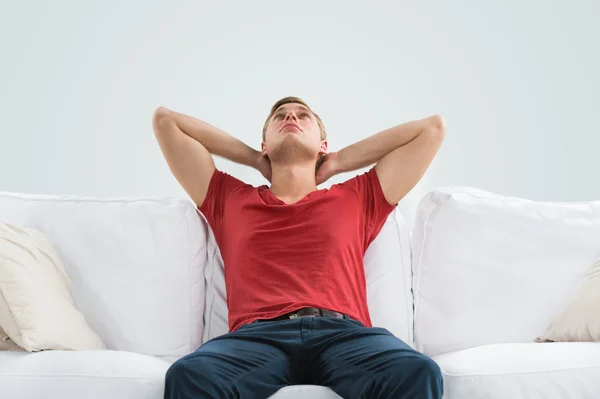 Portrait of a handsome young man looking upwards while relaxing — Stock Photo, Image