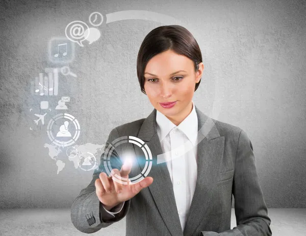 Businesswoman and virtual interface with web and social media icons — Stock Photo, Image