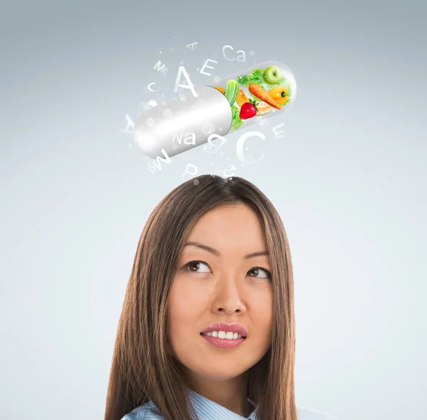 Healthy life concept. Woman with vitamins overhead — Stock Photo, Image