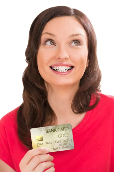 Woman holding golden plastic bank card — Stock Photo, Image