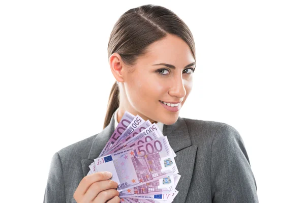 Geschäftsfrau hält und zeigt viele Euro-Banknoten — Stockfoto