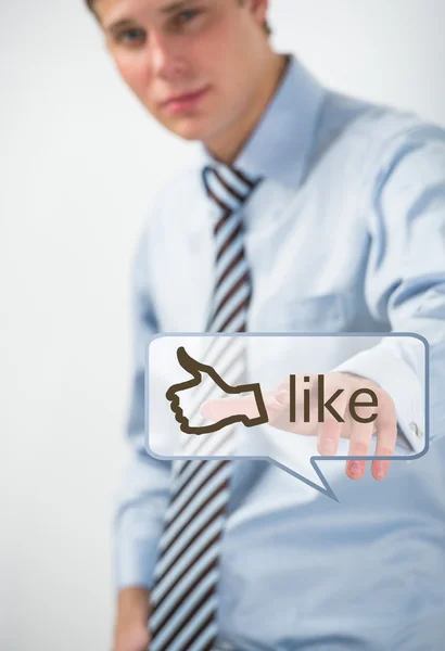 Business man touching social media button with thumb up symbol — Stock Photo, Image